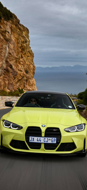 Yellow Bmw M In A Hillside Road Wallpaper