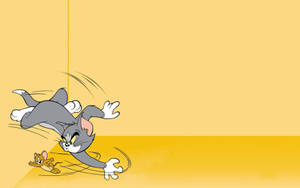 Yellow-colored Tom And Jerry Wallpaper