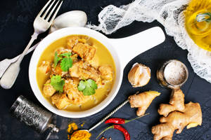 Yellow Curry In A Pot And Spices Wallpaper