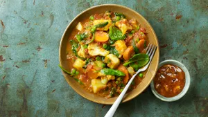 Yellow Curry With Herbs And Creamy Sauce Wallpaper