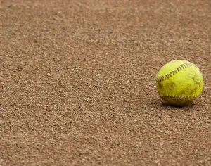 Yellow Cute Softball On The Ground Wallpaper