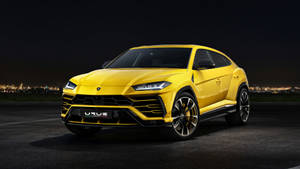 Yellow Lambo Truck At Night Wallpaper