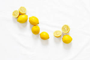Yellow Lemons On White Surface Wallpaper