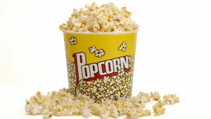 Yellow Popcorn Bucket Overflowing Wallpaper
