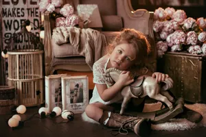 Young Cute Girl With Toy Horse Wallpaper