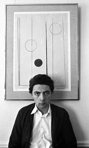 Young Man Before Abstract Artwork Wallpaper