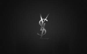 Ysl Logo In Carbon Texture Wallpaper