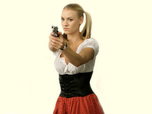 Yvonne Strahovski With Pigtails And Gun Wallpaper