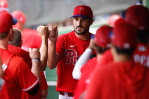 Zach Eflin Fist Bump With Teammates Wallpaper